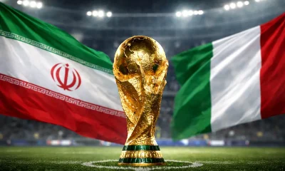 bandiere iraniana e italiana con al centro la coppa del mondo